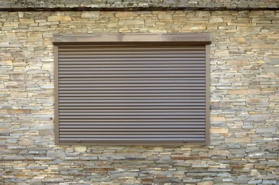 a-window-with-brown-metal-rolling-shutters-wall-d-2023-11-27-05-23-39-utc-min