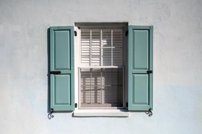 teal-shutters-with-partially-open-window-2024-12-02-17-18-57-utc-min (1)